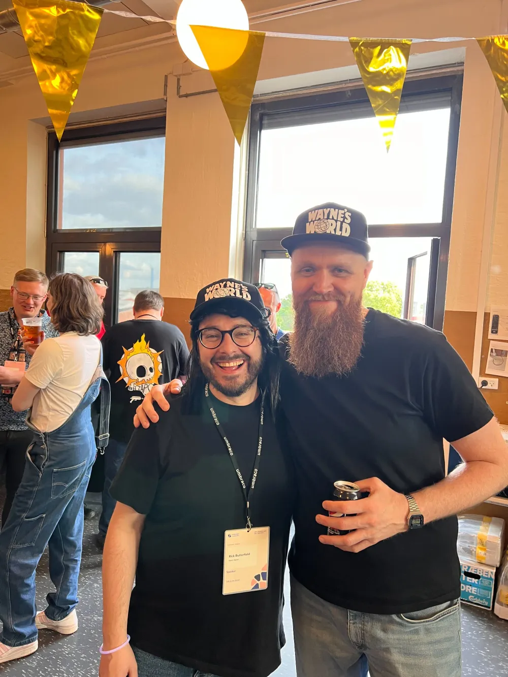 Rick and Matt at Umbraco HQ wearing matching black "Wayne's World" baseball caps and black tshirts